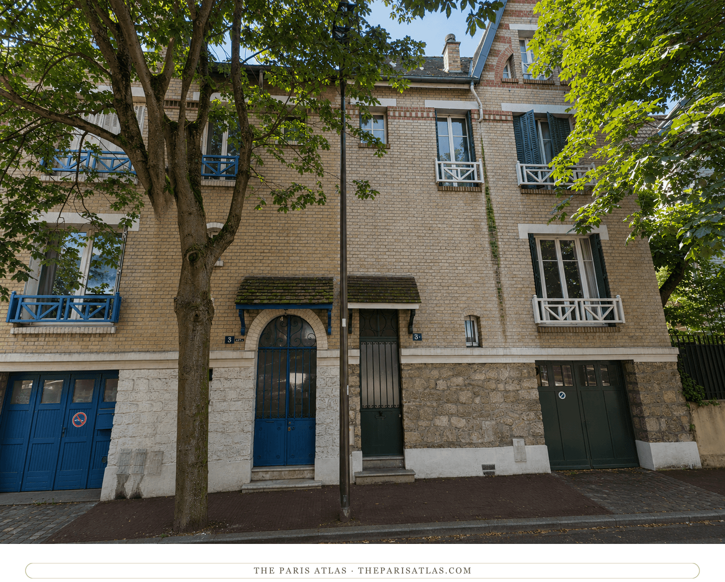 The same house at 3 rue du Bac in colour, pale brick with blue and green painted joinery under a chestnut tree