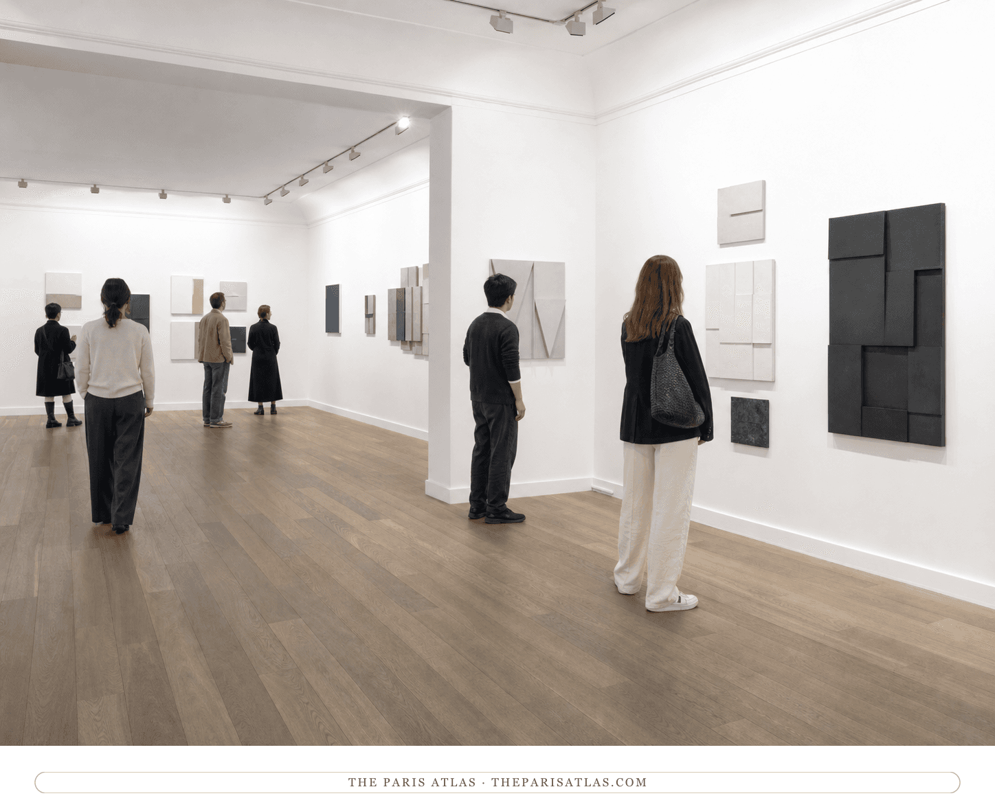 Visitors viewing newly invented geometric reliefs in the present-day Galerie Lelong rooms