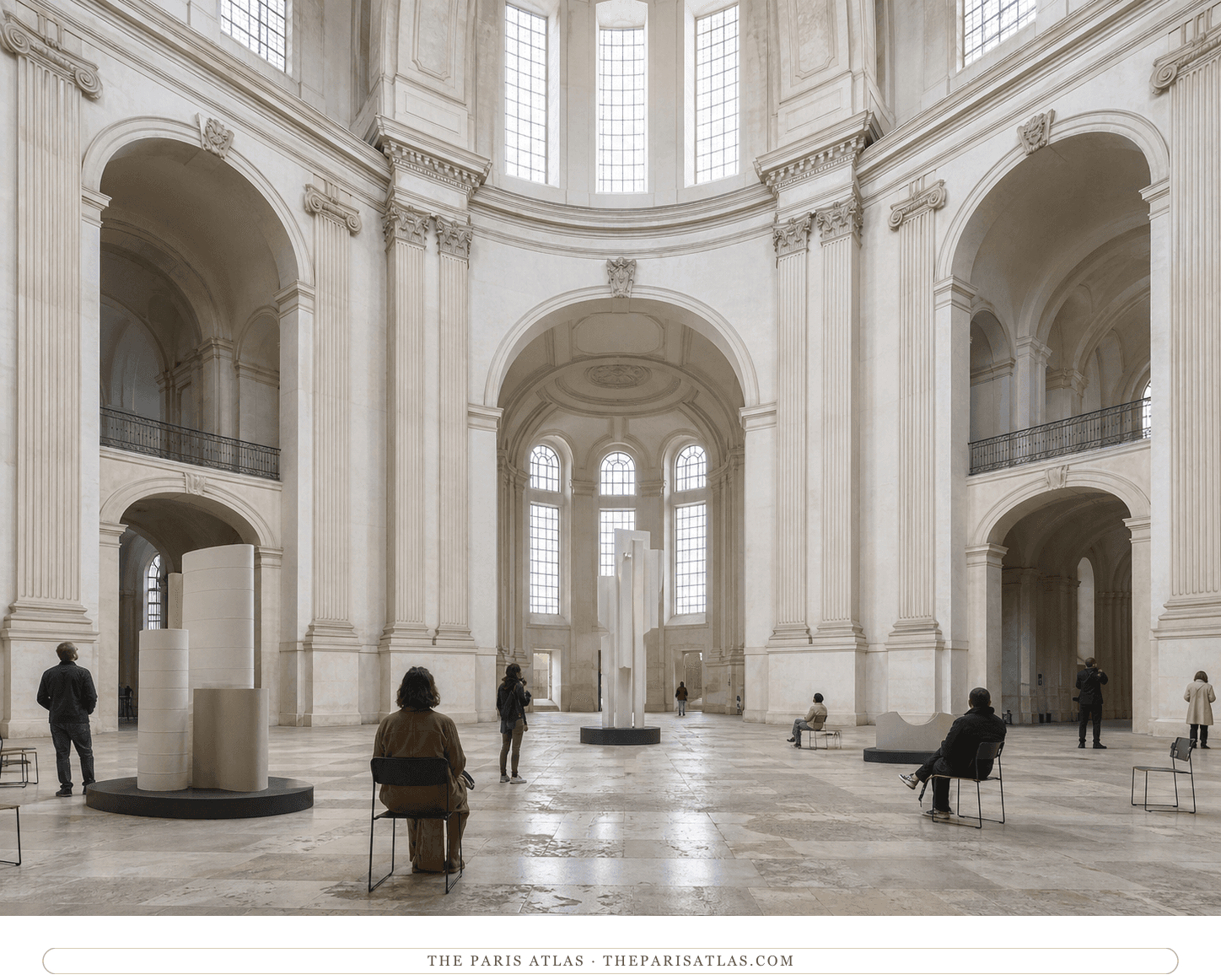 Visitors in the luminous Greek-cross interior of the Chapelle Saint-Louis