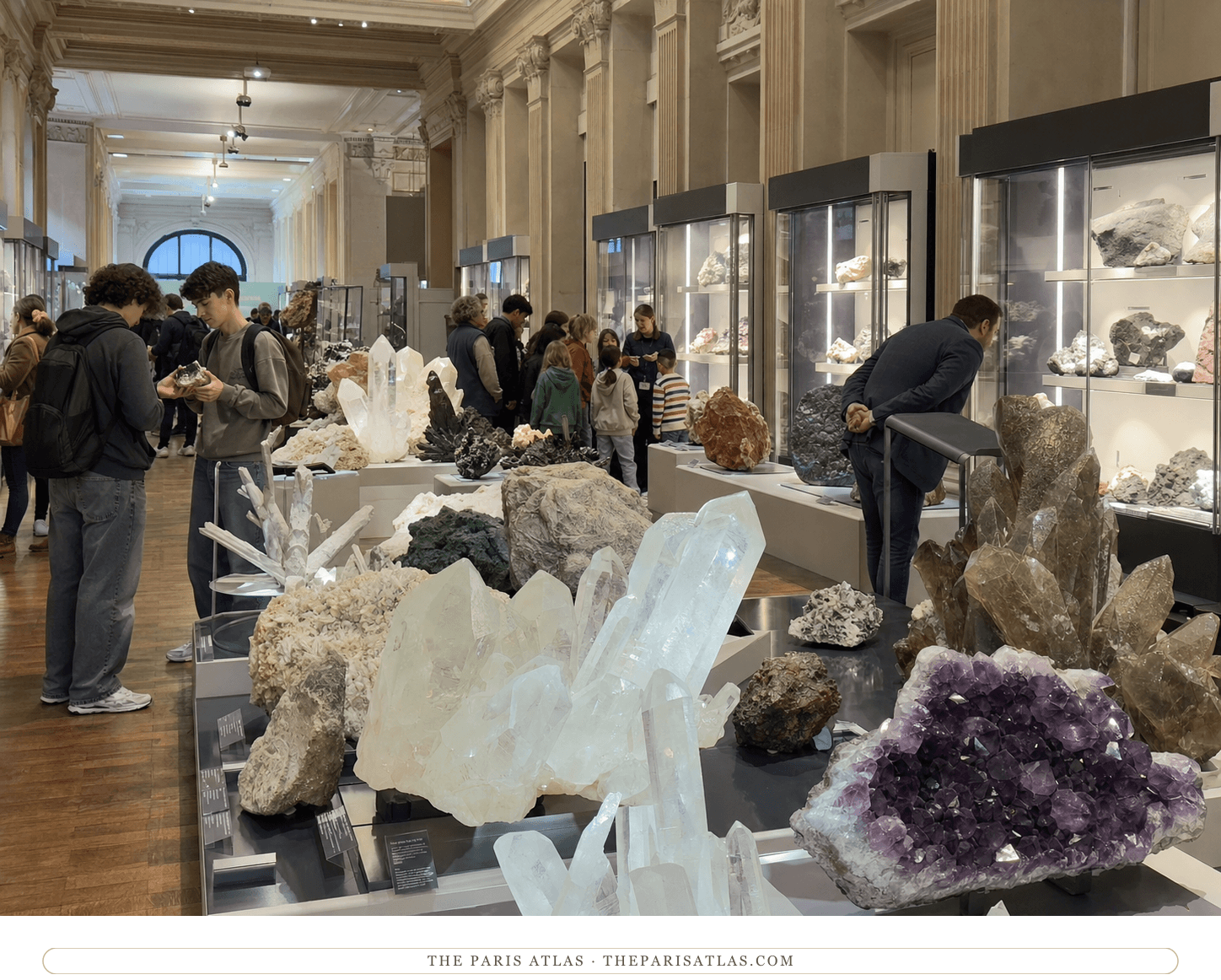 Visitors examining giant quartz and amethyst specimens in the Geology and Mineralogy Gallery
