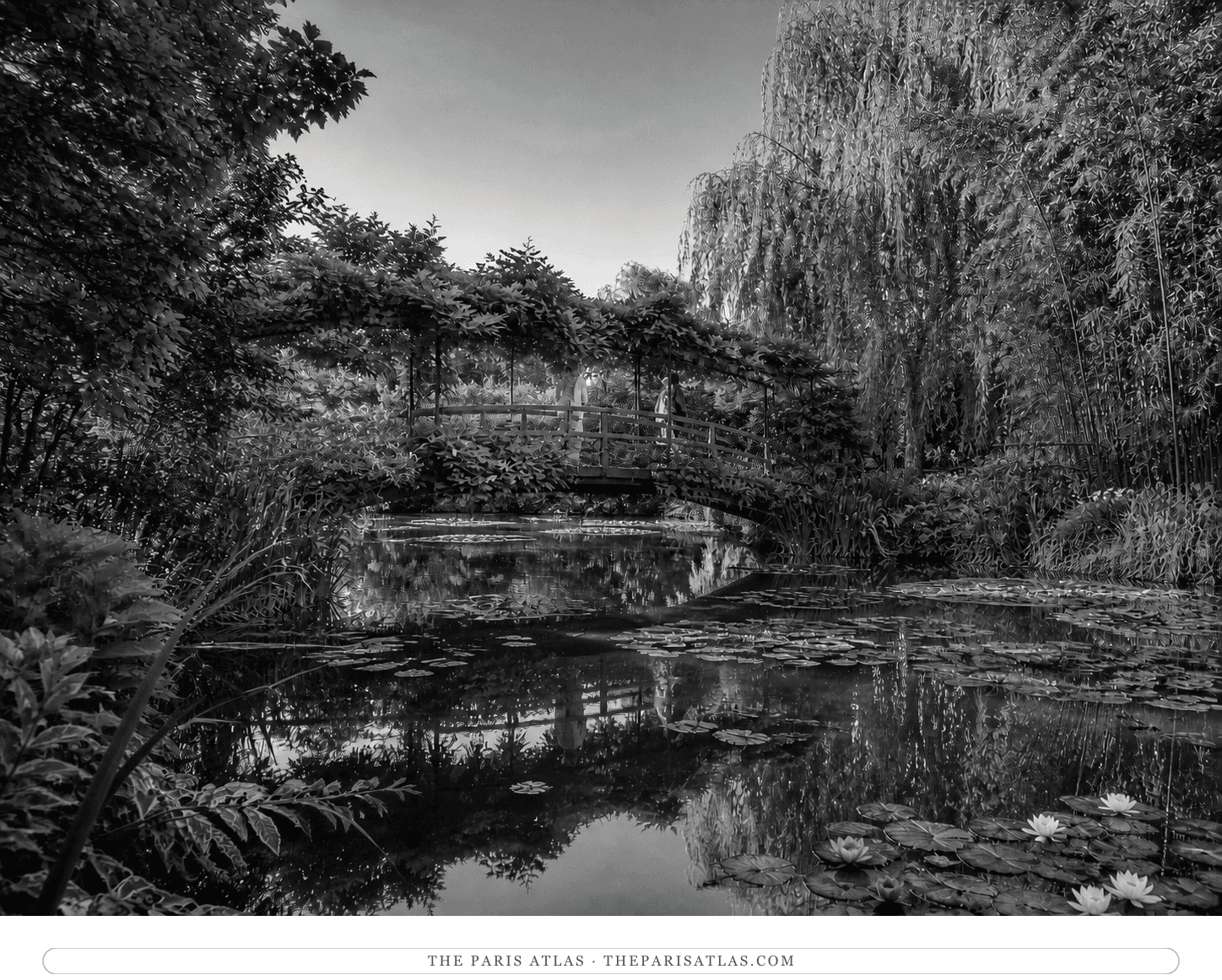Black-and-white view of the Japanese bridge reflected in Monet's water-lily pond at Giverny