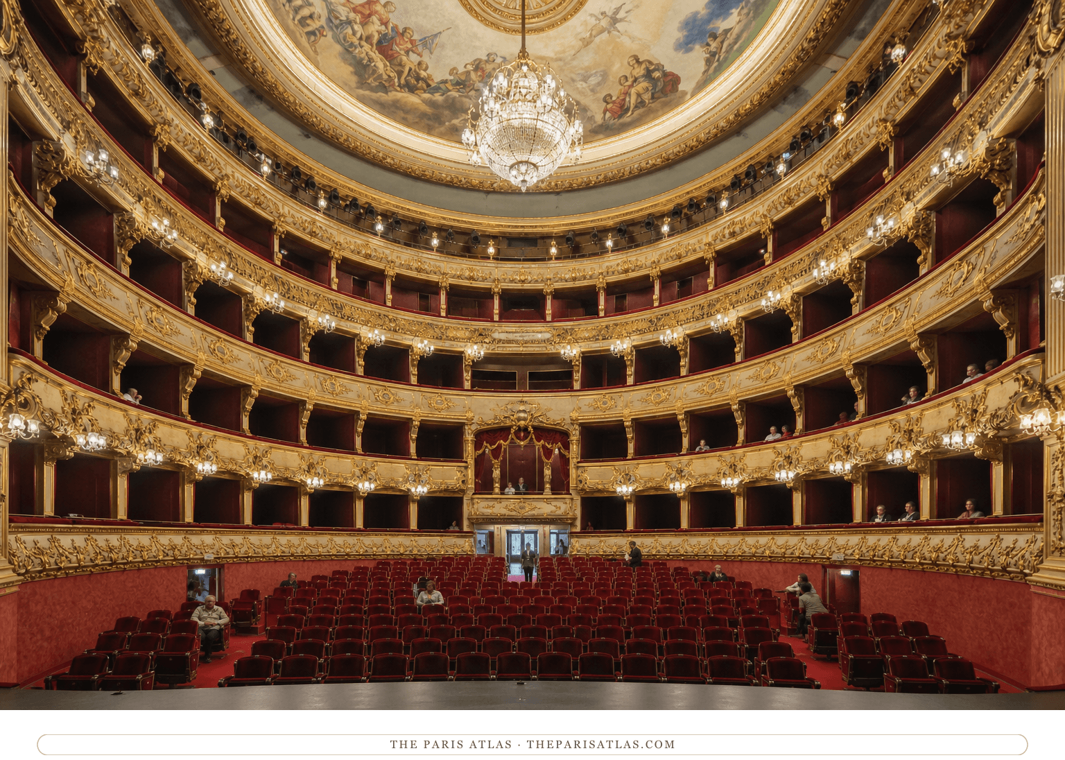 Photorealistic interior view across the red-and-gold Salle Favart auditorium