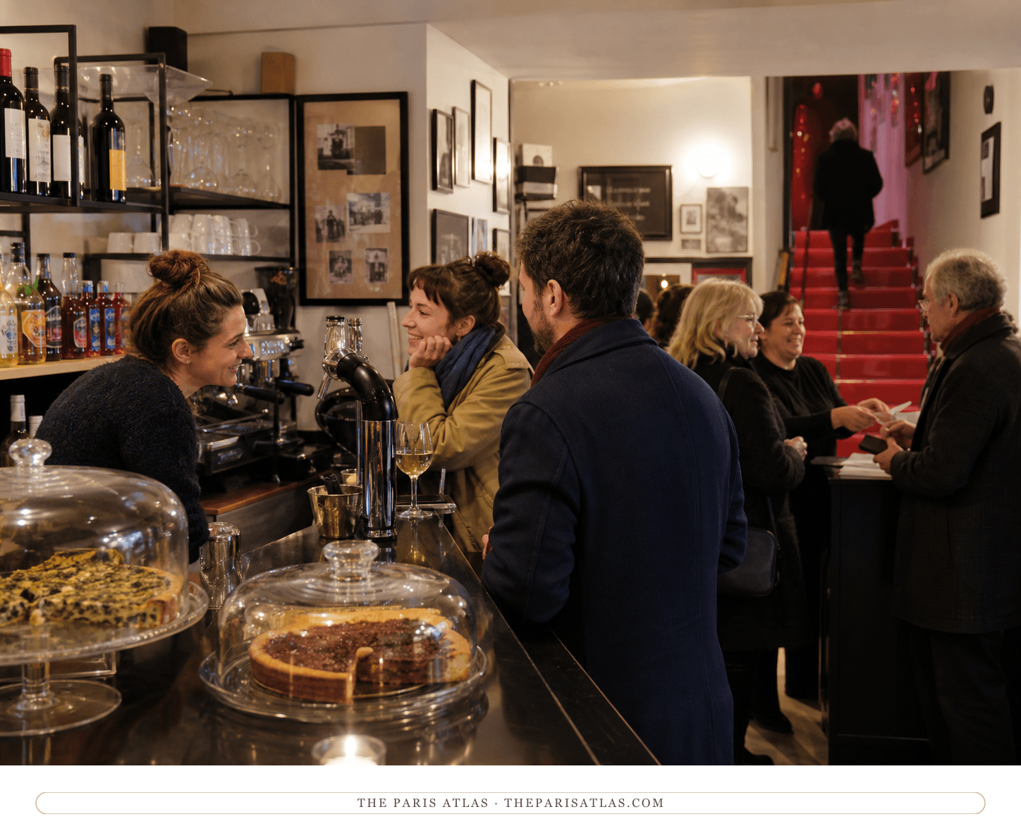Patrons gathering over wine and homemade tarts at Studio 28's cinema bar
