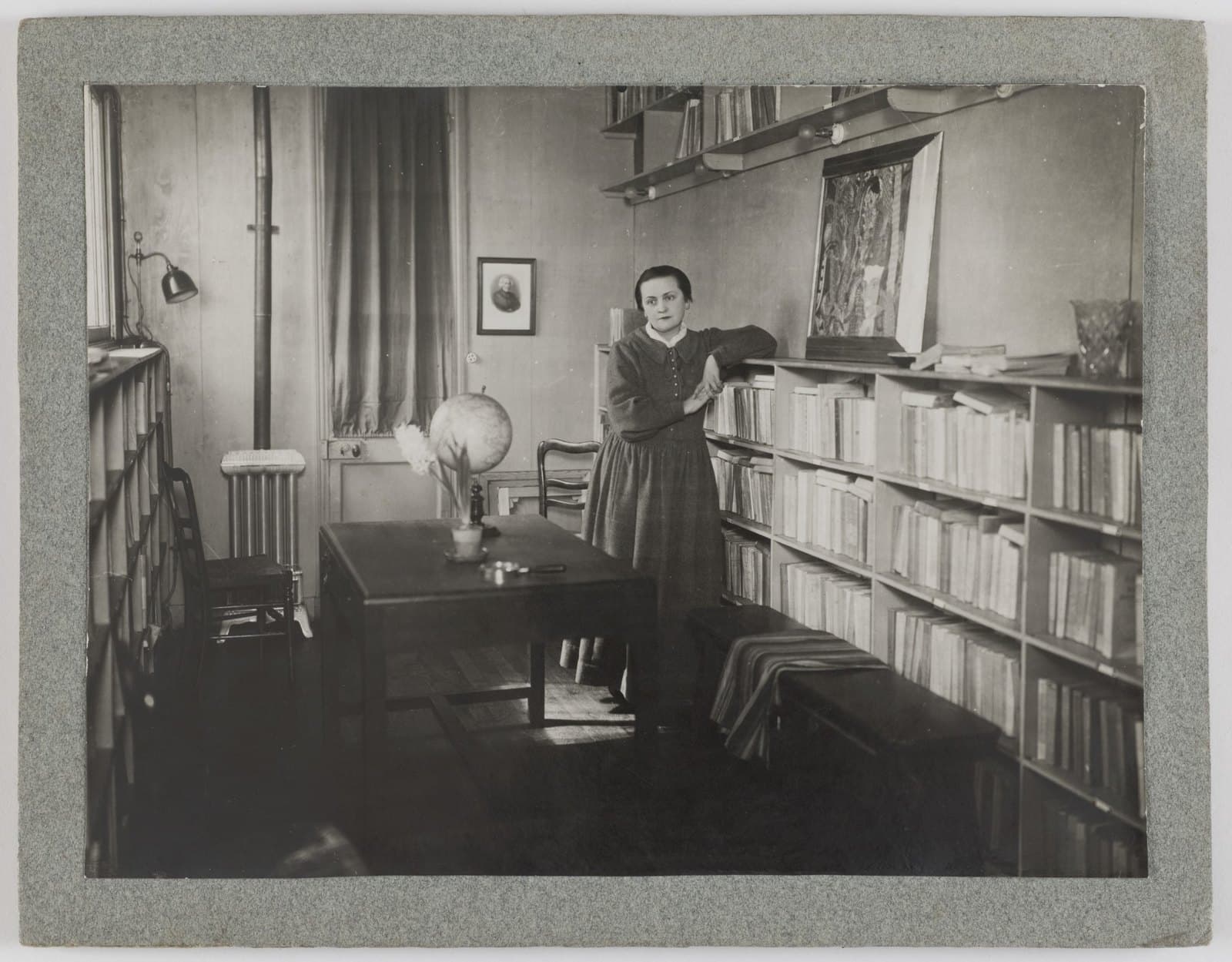 Adrienne Monnier in the back room of her bookshop, surrounded by books