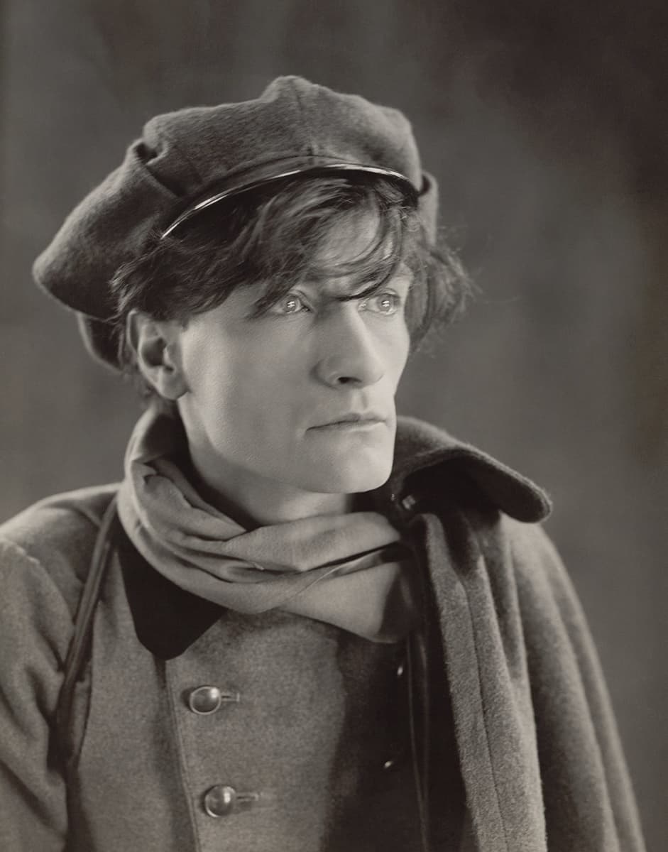 Antonin Artaud in 1926, in a soft cap and knotted scarf, looking past the camera