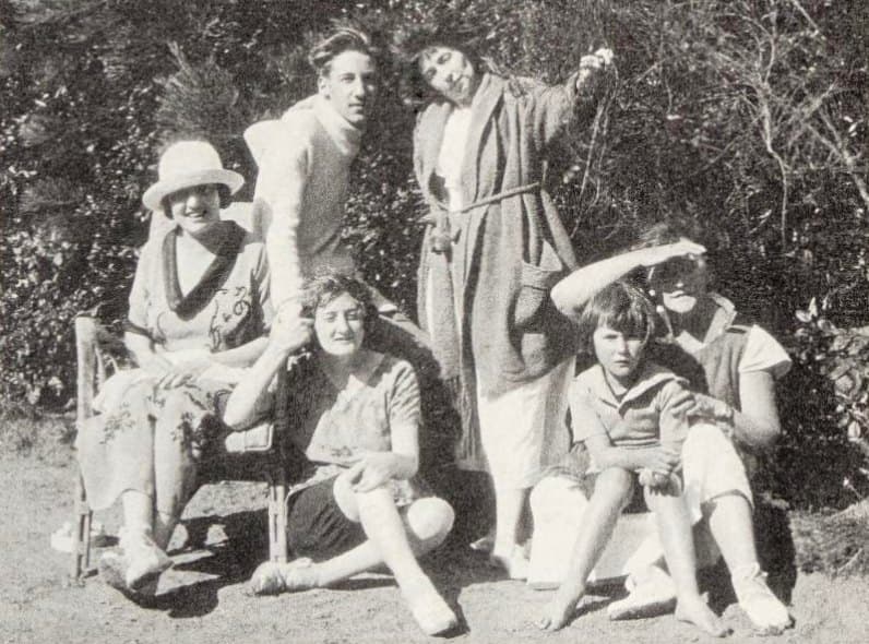 Colette seated outdoors with a group of women friends at Rozven in Brittany in the 1920s