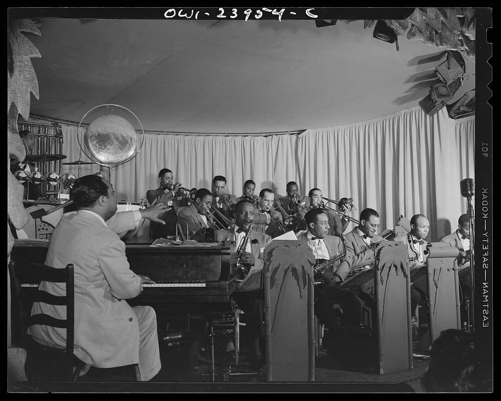 Duke Ellington directing his orchestra from the piano in New York in 1943