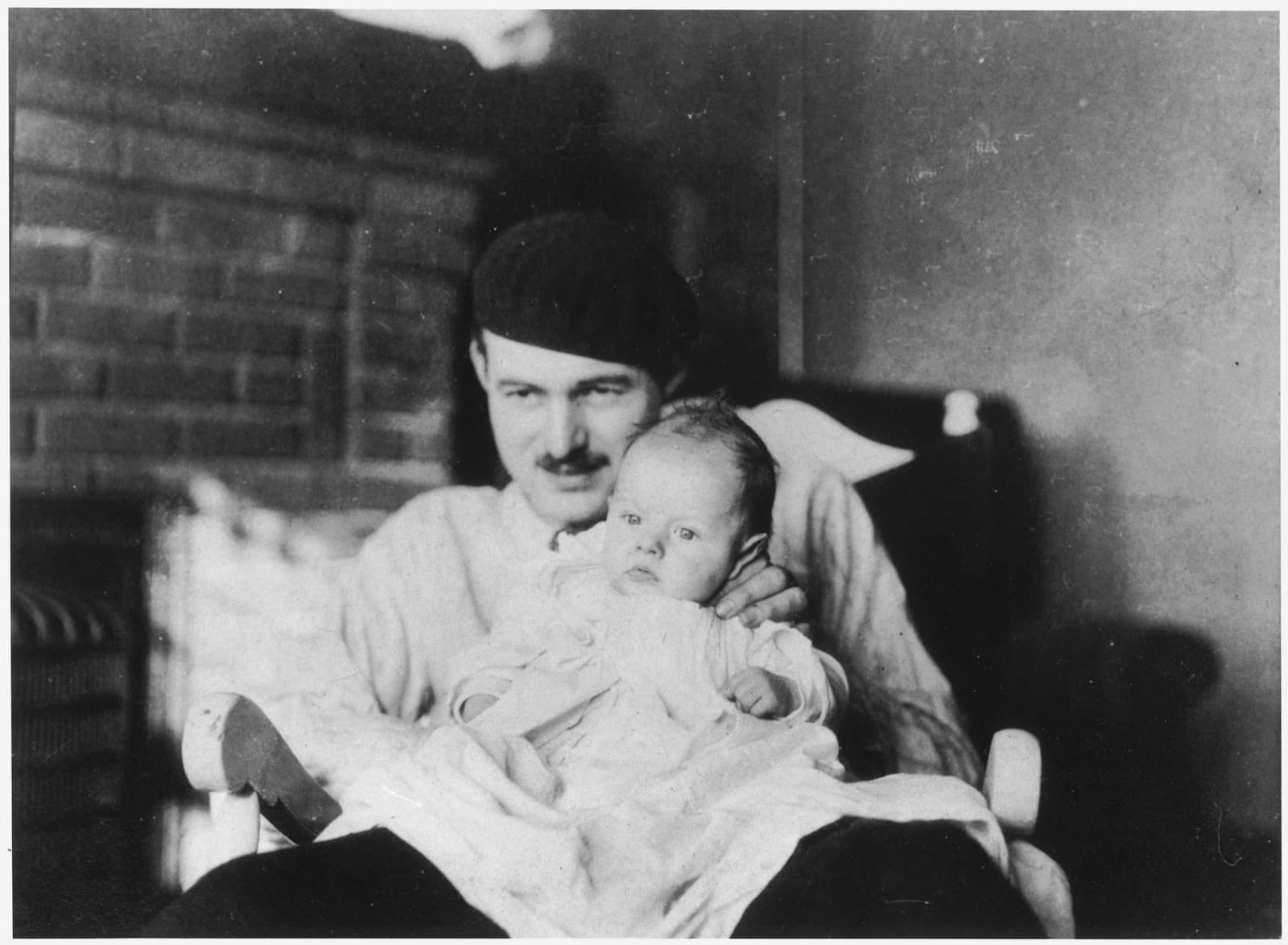 Ernest Hemingway holding his son Bumby, 1927