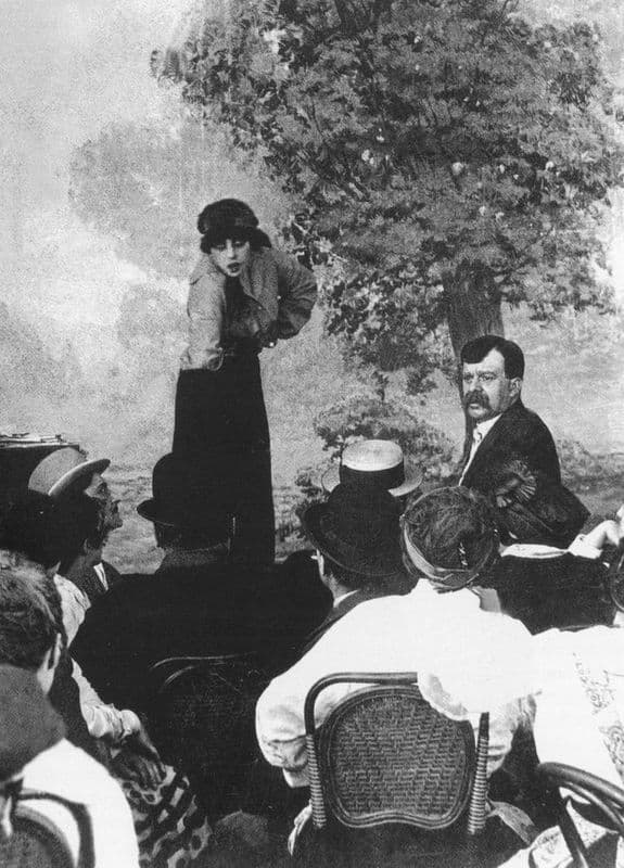 Musidora as Irma Vep in Le Cryptogramme rouge, in the black hood, eyes darkened, staring past the camera