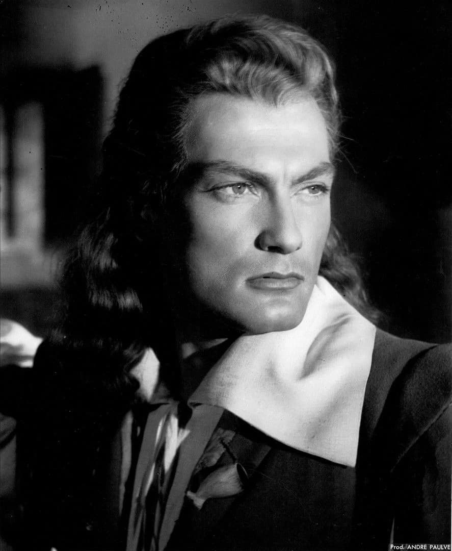 Jean Marais as Avenant, handsome and human, in a doublet with rolled sleeves