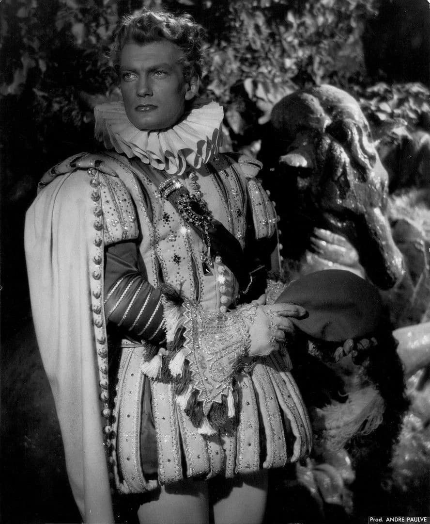 Jean Marais as Prince Ardent in shining court dress, transformed and human again