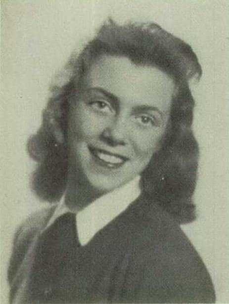 Black-and-white yearbook portrait of Joan Mitchell at seventeen, her hair shoulder-length, looking slightly past the camera