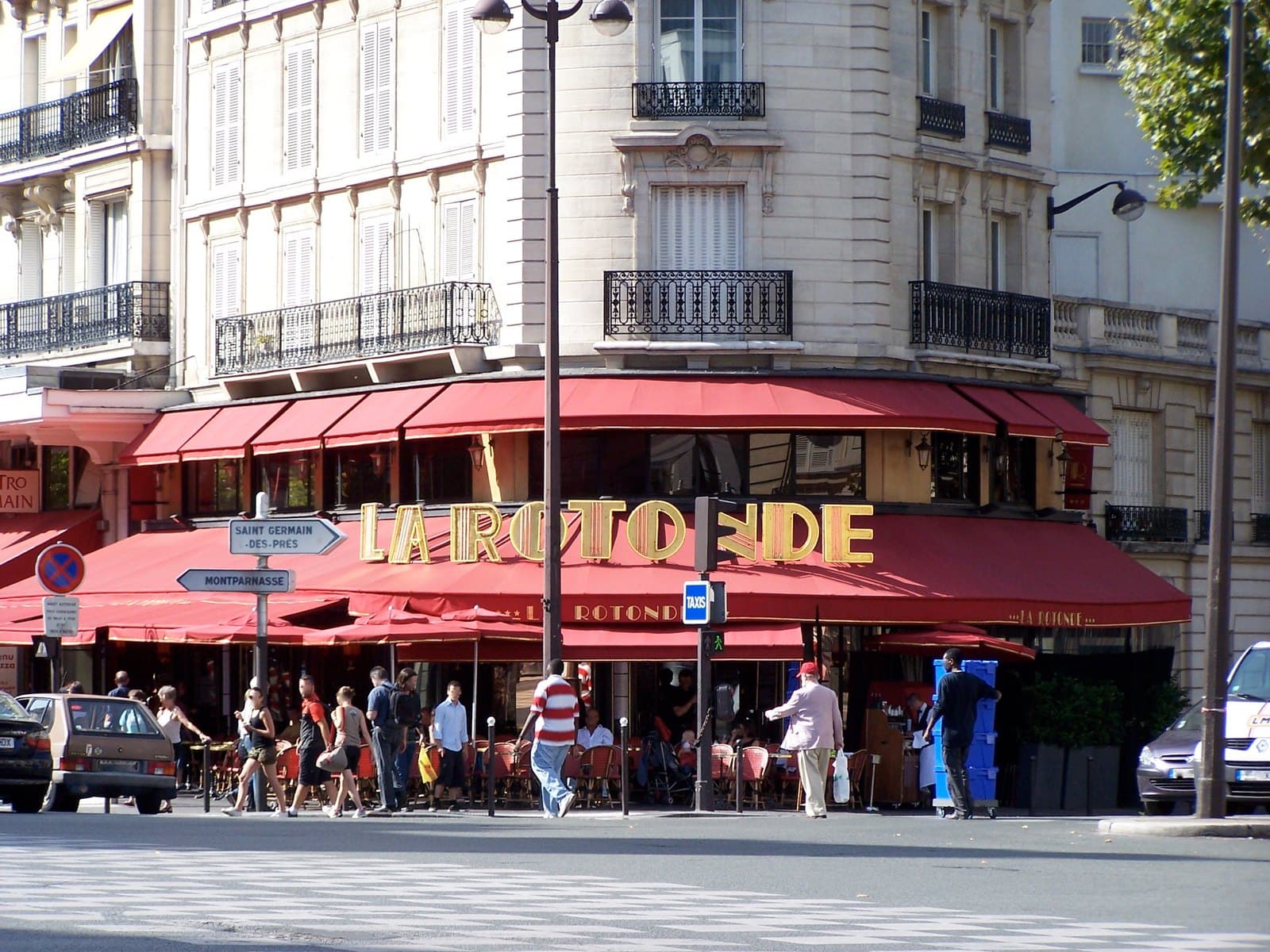 The red awning and corner frontage of La Rotonde at the boulevard du Montparnasse and boulevard Raspail