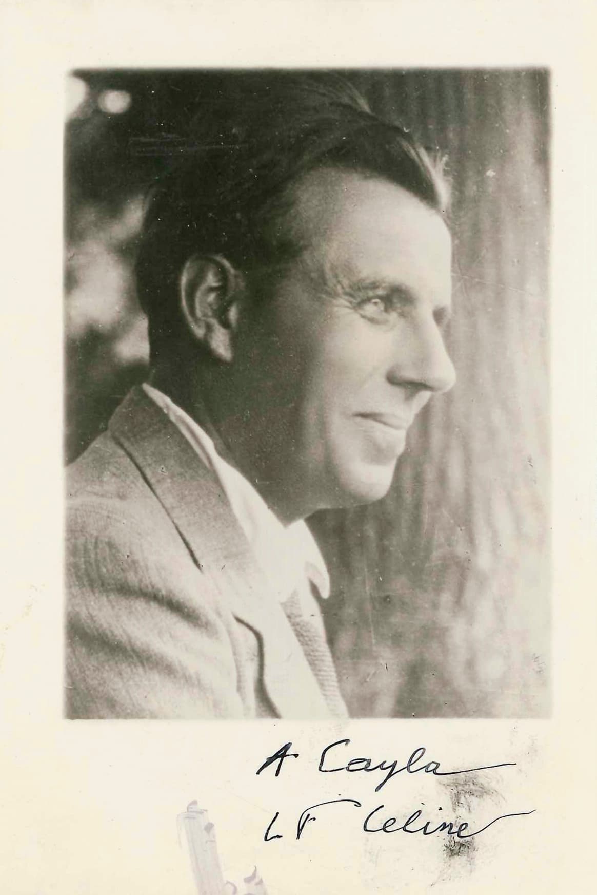 Louis-Ferdinand Céline photographed by Henri Manuel around 1936 — a half-length portrait in a dark coat and open-collared shirt, looking to the viewer's right, taken between the publication of Death on the Installment Plan and the first of the political pamphlets.
