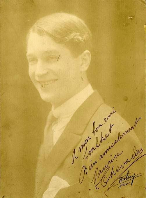 Maurice Chevalier in a tuxedo and straw boater around 1920