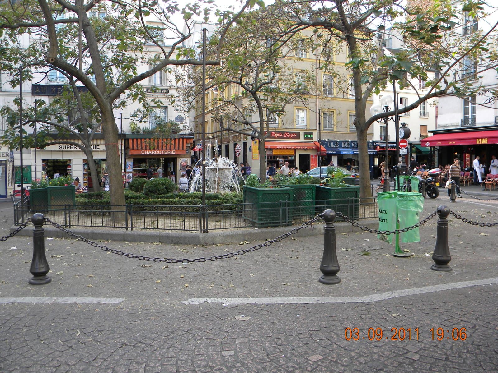 The Place de la Contrescarpe in Paris, cafés and trees around the central fountain