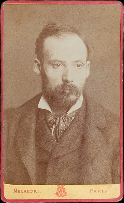 Carte de visite photograph of Renoir in his thirties, seated, with short hair and a light beard