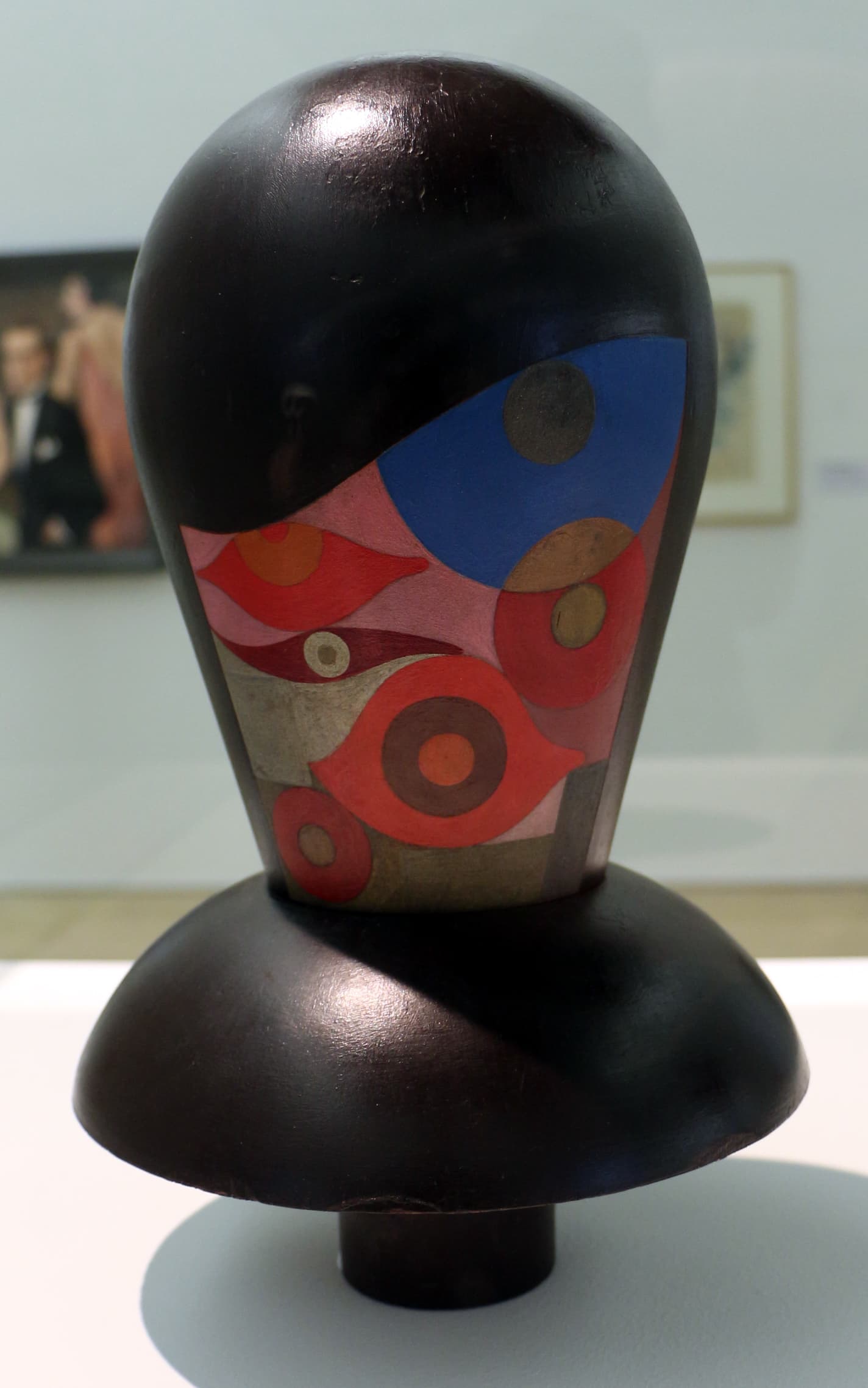 Sophie Taeuber-Arp's Dada Head: a turned and painted wooden head on a stand, its face divided into flat geometric zones of colour