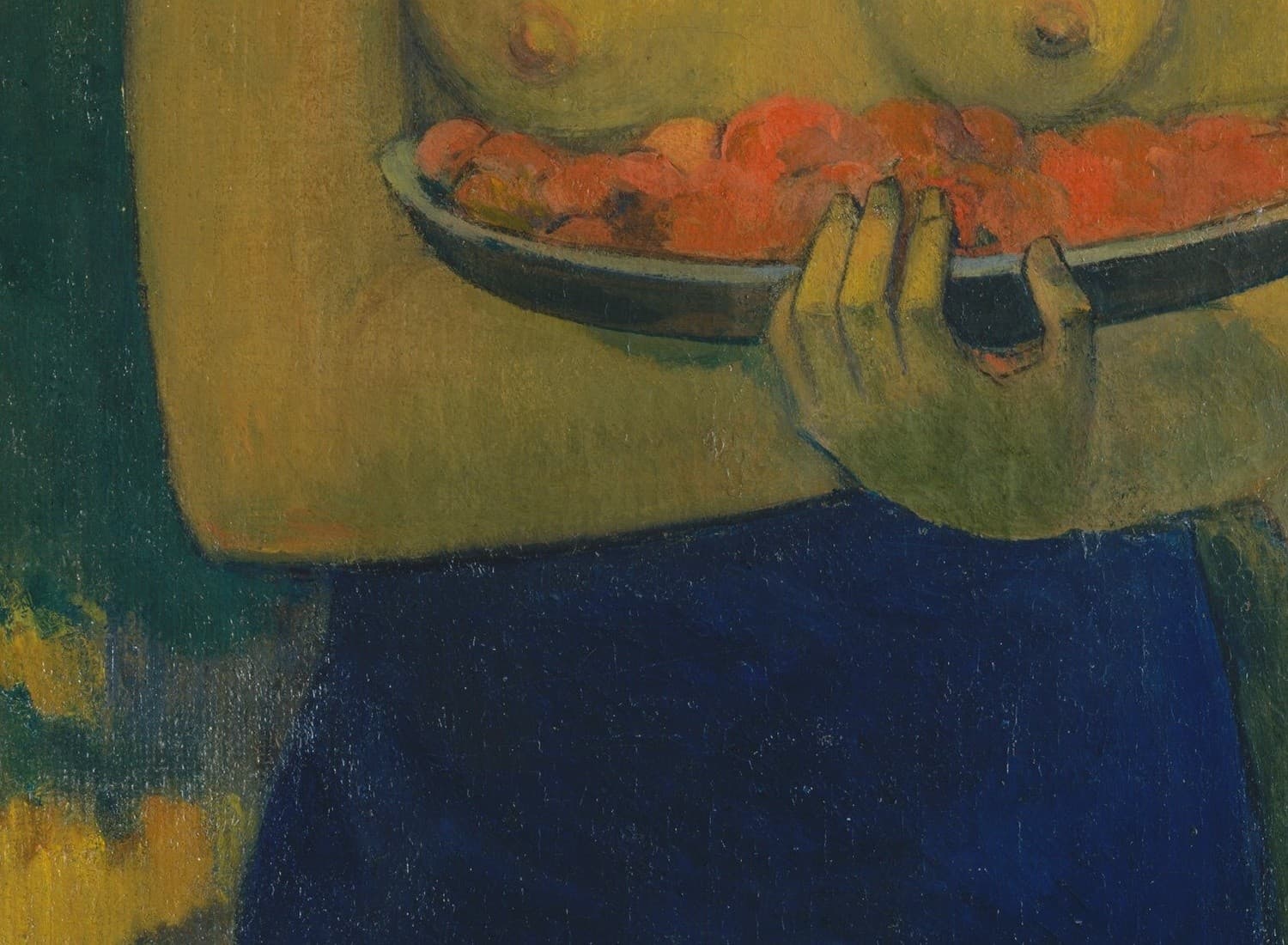 Detail of Two Tahitian Women: a wooden tray heaped with red-orange mango blossoms, steadied by one hand beneath the bearer's chest