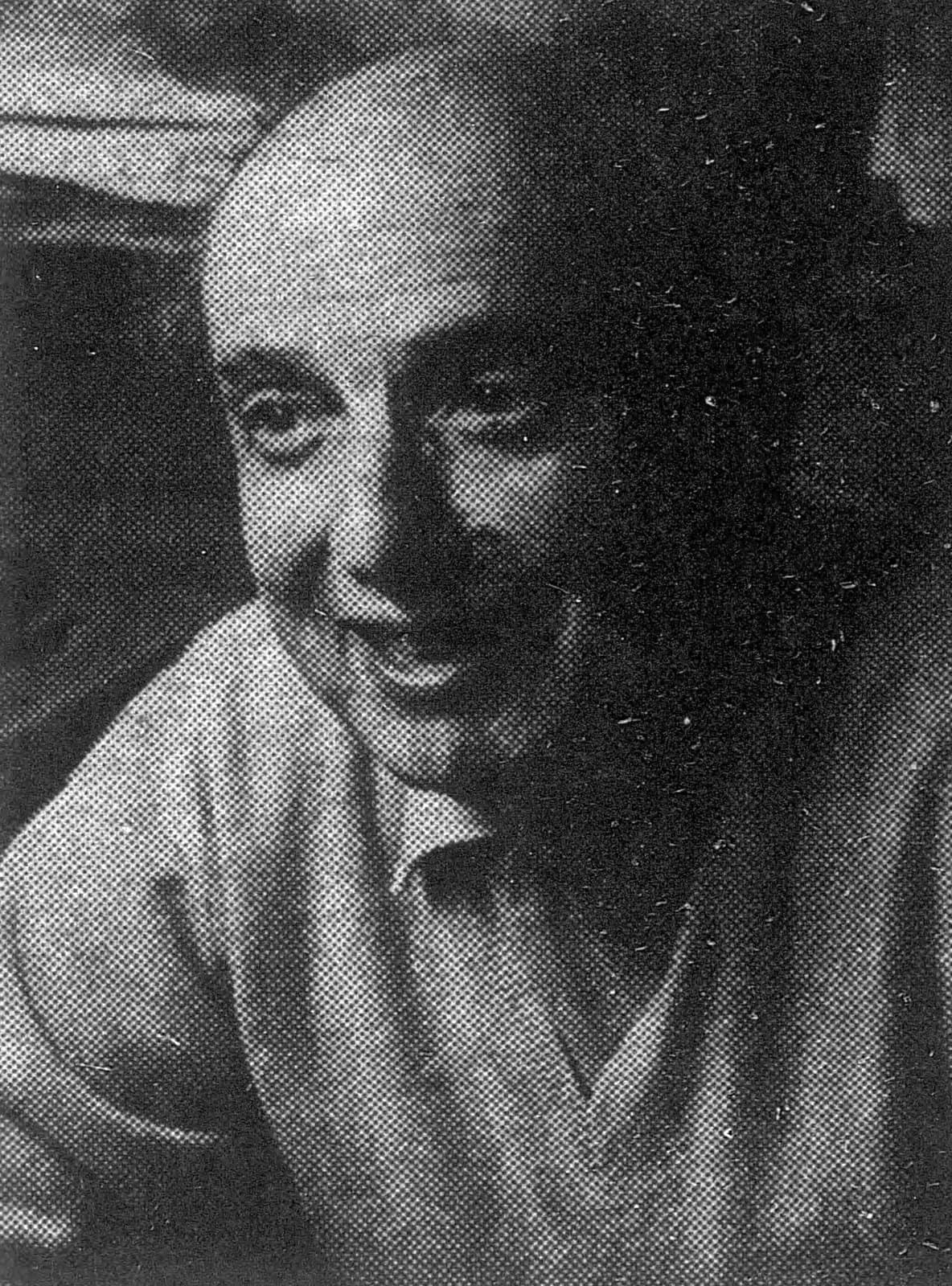 Walter Lowenfels smiling in an open-collared shirt, in a halftone newspaper photograph from 1969.